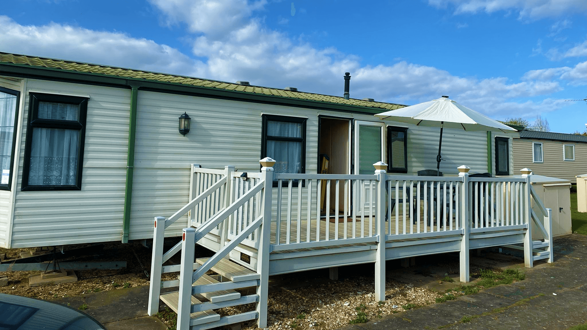 Private decking area with outdoor seating, perfect for morning coffee or evening relaxation